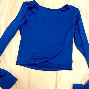 Bright blue latina long sleeved tight shirt from colombia